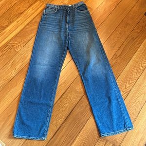 Great condition. See photo for discolored area on back of leg.